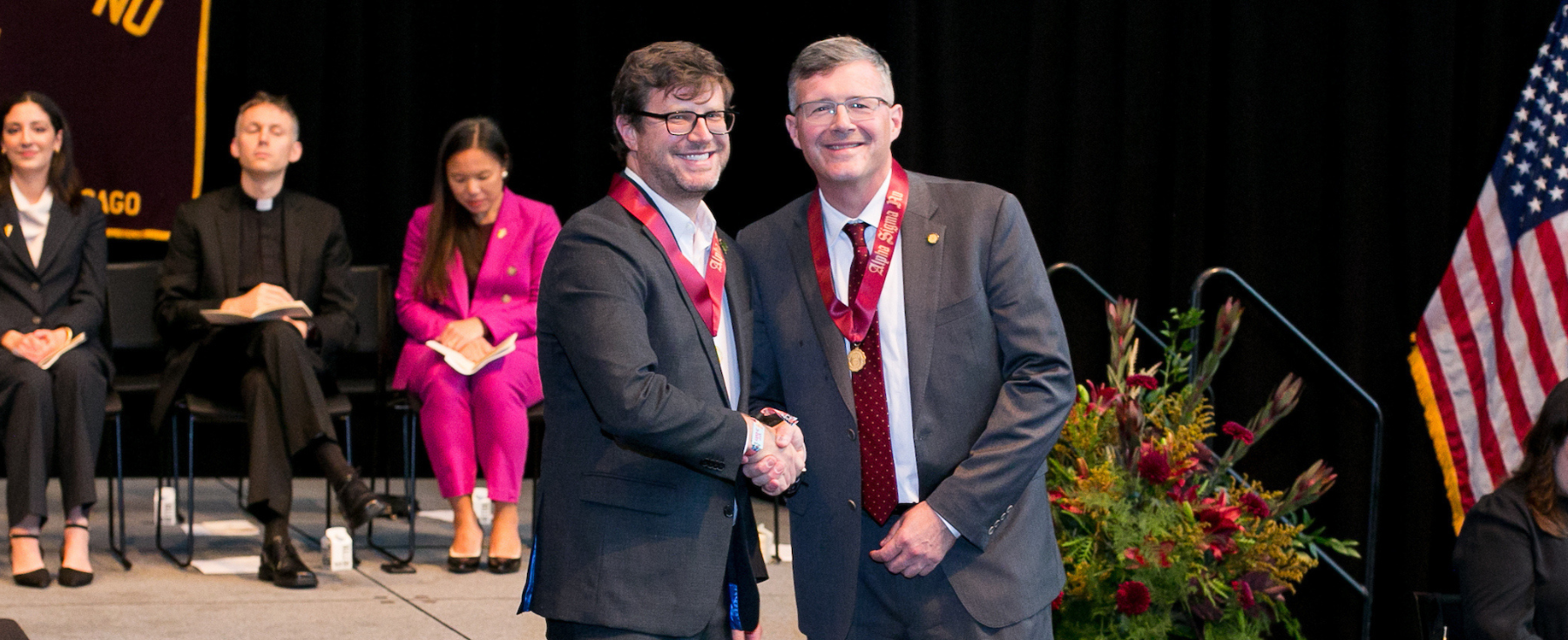 School of Education student Ryan Johnson shakes hands with Dr. Woods. School of Education student Ryan Johnson shakes hands with Dr. Woods.
