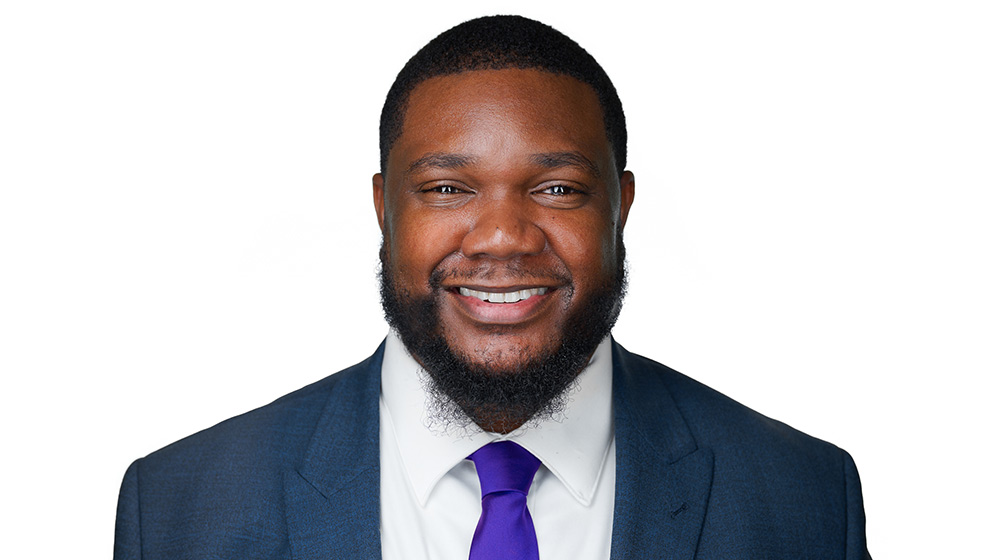 Quinton Arthur smiling on a white background