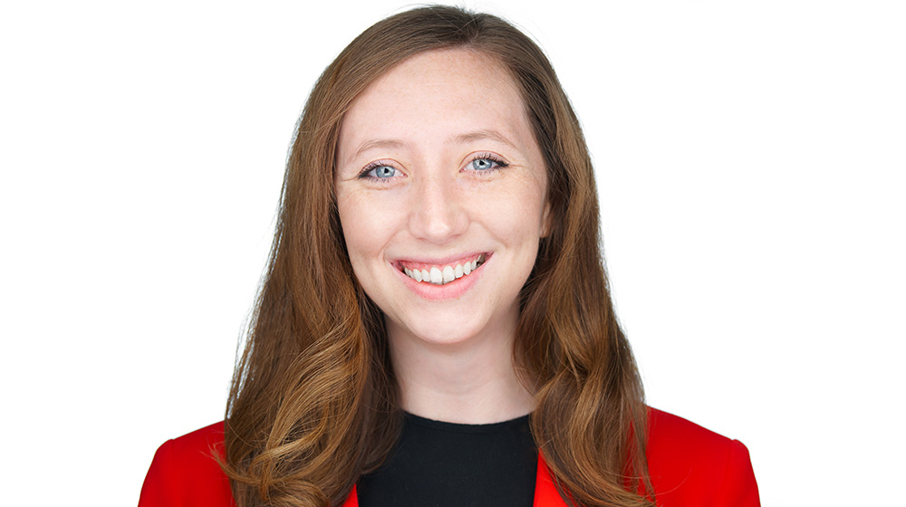 Headshot of Madeline Stanton on a white background