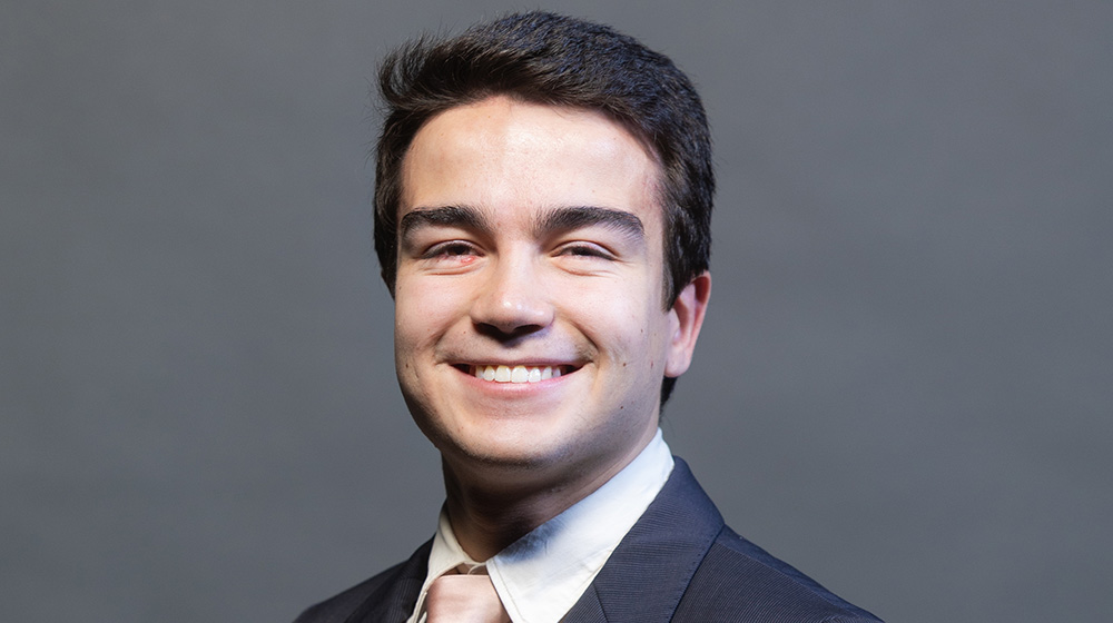 Headshot of João Barreto on a greay background. He's wearing a dark grey suit with a light pink tie. Headshot of João Barreto on a greay background. He's wearing a dark grey suit with a light pink tie.